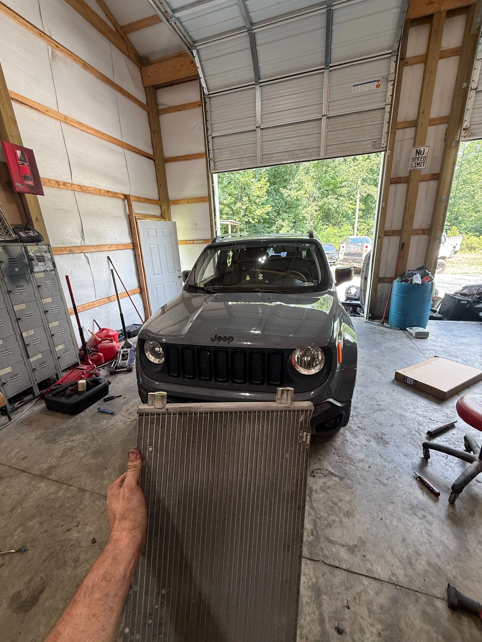 Radiator removed from Jeep during cooling-system repair